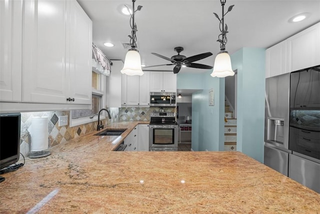 638 Morningstar Dr, Franklin Twp, PA 16117 - kitchen featuring ceiling fan, appliances with stainless steel finishes, tasteful backsplash, hanging light fixtures, and a sink