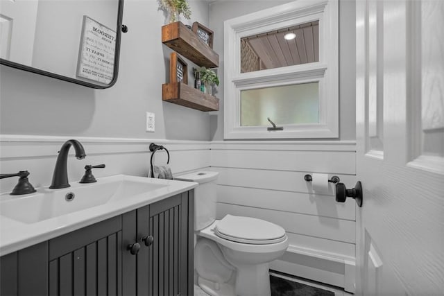 638 Morningstar Dr, Franklin Twp, PA 16117 - half bathroom featuring vanity, a wainscoted wall, baseboard heating, and toilet