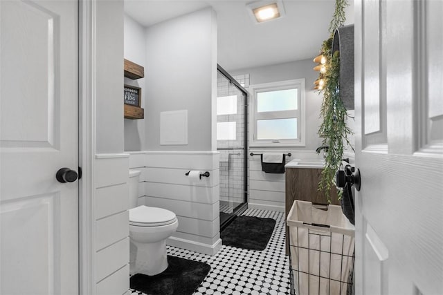 638 Morningstar Dr, Franklin Twp, PA 16117 - bathroom featuring wainscoting, vanity, a shower stall, and toilet