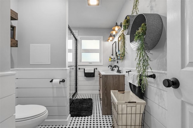 638 Morningstar Dr, Franklin Twp, PA 16117 - bathroom featuring wainscoting, vanity, toilet, tile walls, and a stall shower