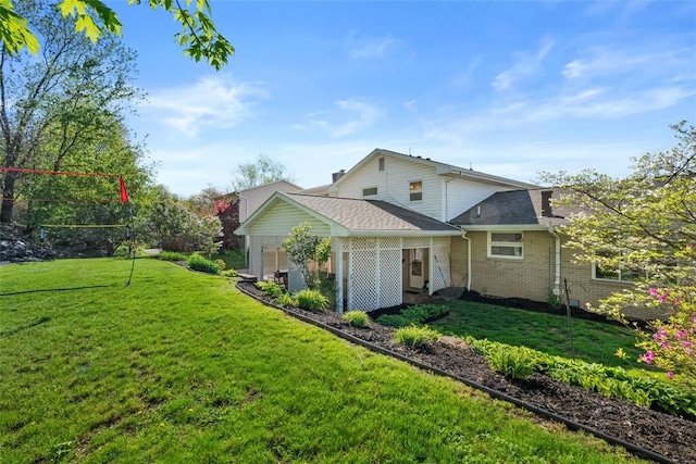 638 Morningstar Dr, Franklin Twp, PA 16117 - back of property featuring a lawn and brick siding