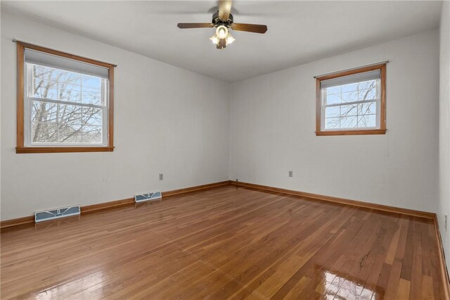 2425 Park Ave, South Franklin, PA 15301 - spare room featuring visible vents, light wood finished floors, ceiling fan, and baseboards