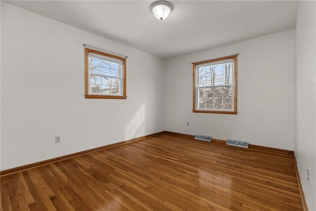 2425 Park Ave, South Franklin, PA 15301 - empty room featuring a healthy amount of sunlight, wood finished floors, and visible vents