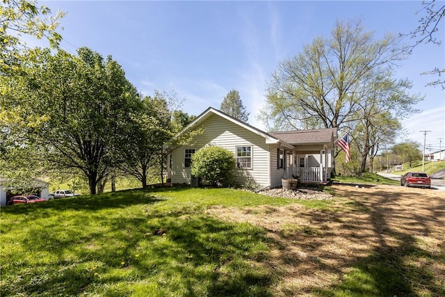 2425 Park Ave, South Franklin, PA 15301 - view of side of home featuring a yard and covered porch
