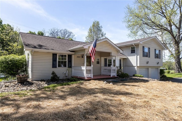 2425 Park Ave, South Franklin, PA 15301 - view of front of home with a garage, covered porch, and roof with shingles