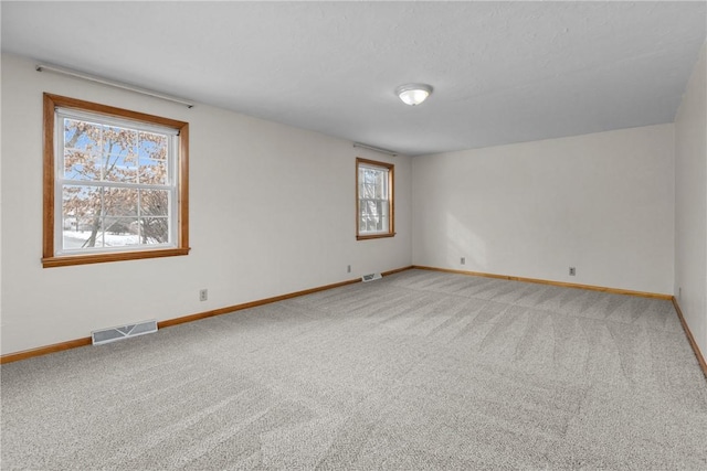 2425 Park Ave, South Franklin, PA 15301 - spare room with baseboards, visible vents, and light carpet