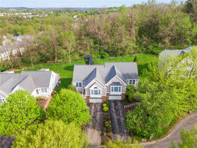 drone / aerial view featuring a view of trees