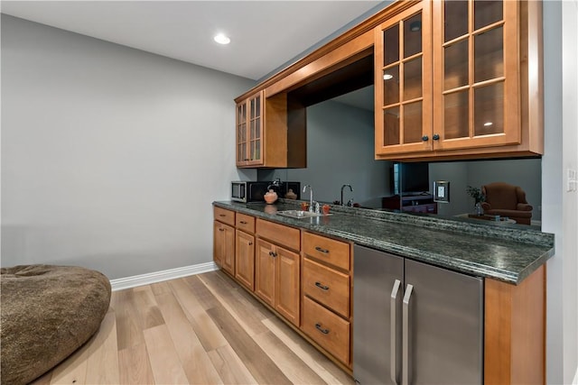 3061 Edelweiss Ct, Adams Twp, PA 16046 - bar featuring recessed lighting, baseboards, light wood finished floors, and a sink