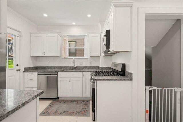 1117 Woodbourne Ave, Brookline, PA 15226 - kitchen with stainless steel appliances, white cabinetry, a sink, and dark stone countertops