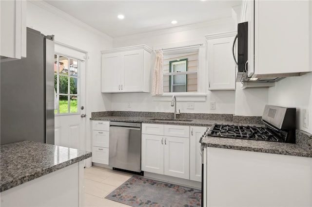 1117 Woodbourne Ave, Brookline, PA 15226 - kitchen with crown molding, stainless steel appliances, white cabinetry, and a sink