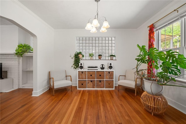 1117 Woodbourne Ave, Brookline, PA 15226 - sitting room featuring an inviting chandelier, baseboards, ornamental molding, and hardwood / wood-style floors