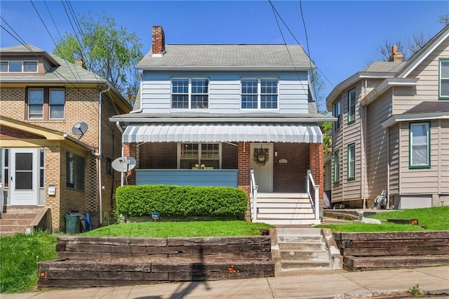 1117 Woodbourne Ave, Brookline, PA 15226 - american foursquare style home featuring brick siding, covered porch, a chimney, and entry steps