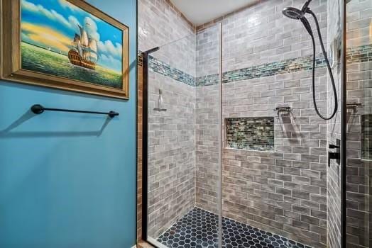 bathroom with a shower stall