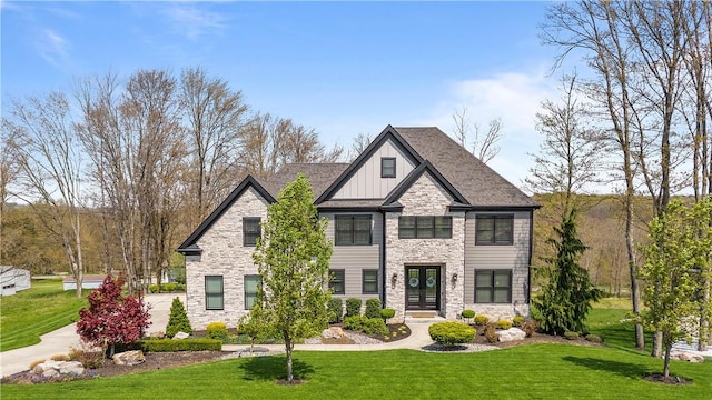 131 Woodford Dr, Adams Twp, PA 16033 - view of front of house with board and batten siding, a front lawn, and stone siding