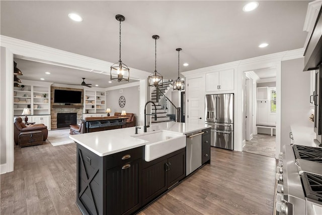 131 Woodford Dr, Adams Twp, PA 16033 - kitchen with crown molding, a sink, high end appliances, and light countertops