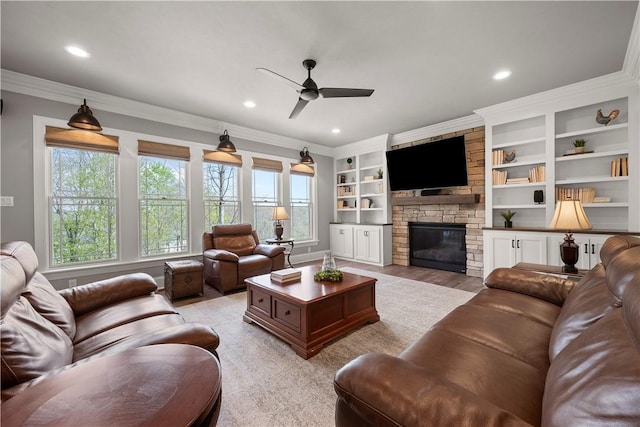 131 Woodford Dr, Adams Twp, PA 16033 - living room with crown molding, recessed lighting, ceiling fan, and a fireplace