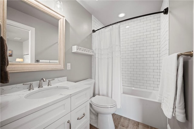 131 Woodford Dr, Adams Twp, PA 16033 - full bathroom featuring vanity, shower / tub combo with curtain, wood finished floors, and toilet
