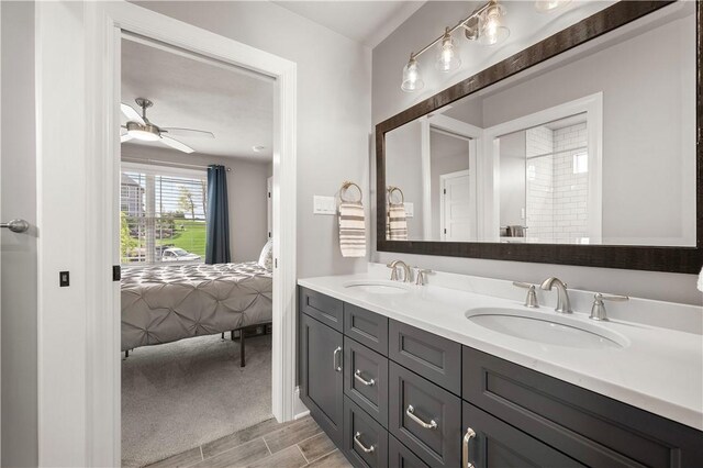 131 Woodford Dr, Adams Twp, PA 16033 - ensuite bathroom featuring double vanity, a sink, ensuite bathroom, and wood finished floors