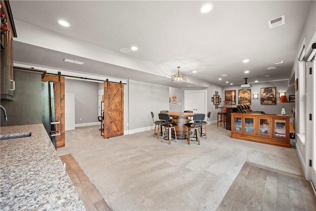 131 Woodford Dr, Adams Twp, PA 16033 - dining room featuring visible vents, a barn door, baseboards, light wood-style floors, and recessed lighting