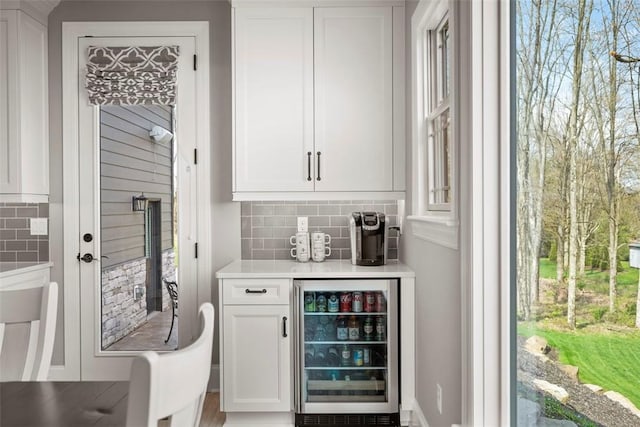131 Woodford Dr, Adams Twp, PA 16033 - bar with backsplash and wine cooler