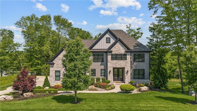 131 Woodford Dr, Adams Twp, PA 16033 - view of front facade with stone siding, board and batten siding, and a front yard