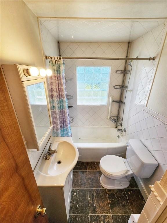 bathroom with tile walls, vanity, toilet, and shower / tub combo with curtain