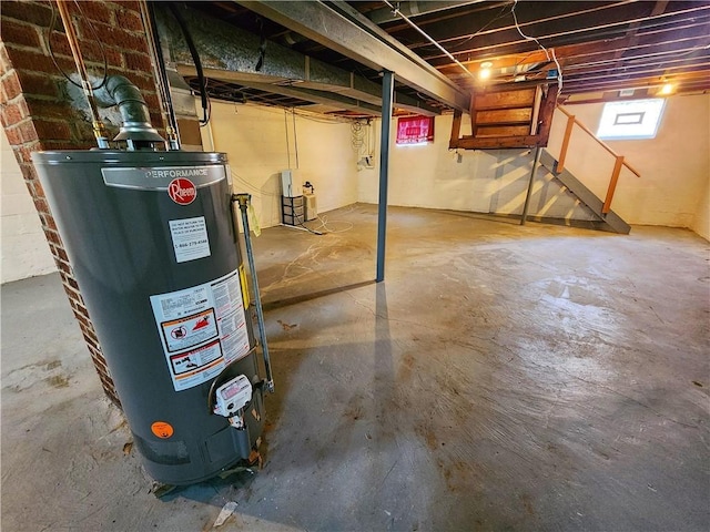 below grade area with stairway and gas water heater