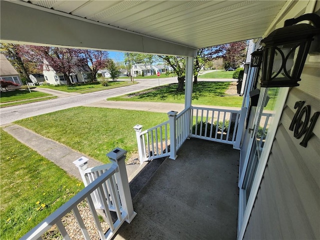 view of patio with a residential view and a porch
