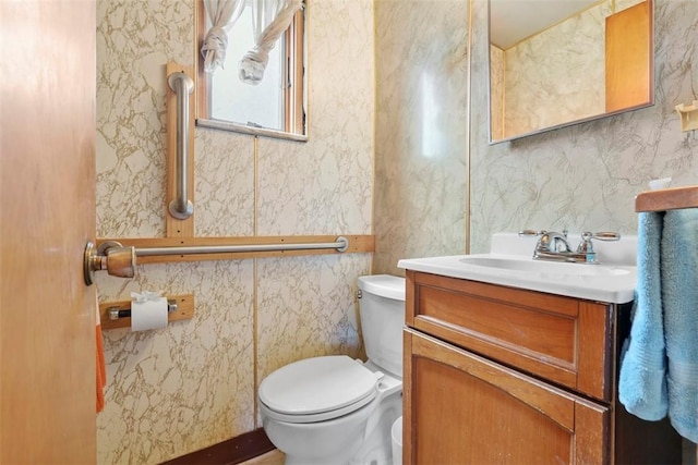 half bath with vanity and toilet