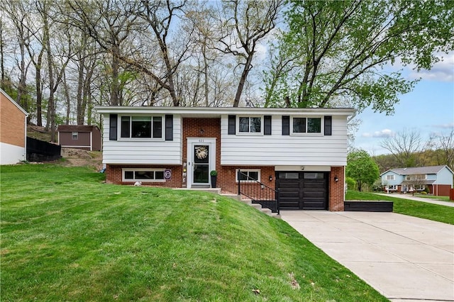 621 Moonstone Dr, Shaler, PA 15101 - split foyer home featuring a garage, a front yard, driveway, and brick siding
