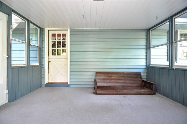 unfurnished sunroom featuring a healthy amount of sunlight