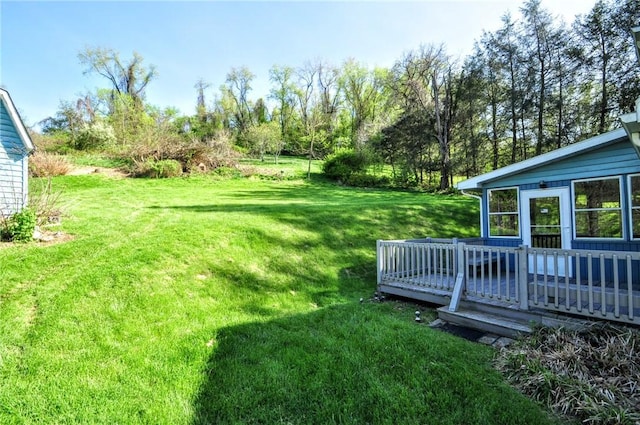 view of yard with a wooden deck