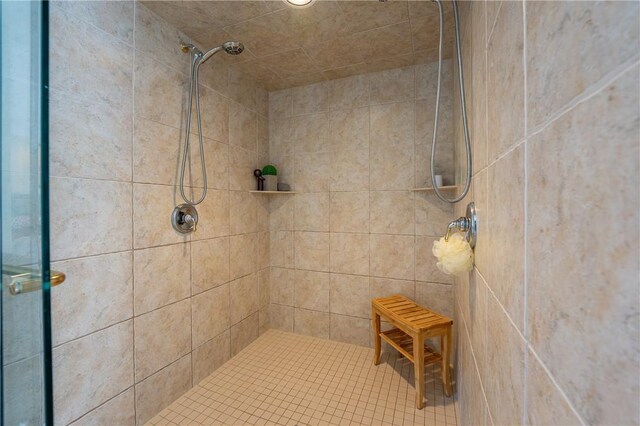 full bathroom featuring a stall shower