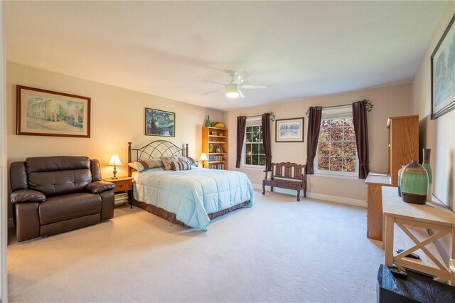 bedroom featuring carpet flooring, a ceiling fan, and baseboards