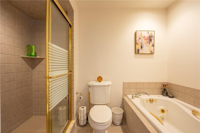 full bath with a whirlpool tub, tile patterned flooring, a stall shower, and toilet
