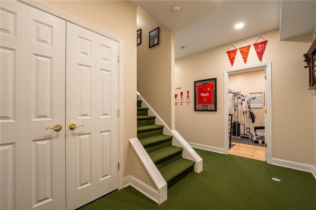 stairs with carpet flooring, recessed lighting, and baseboards