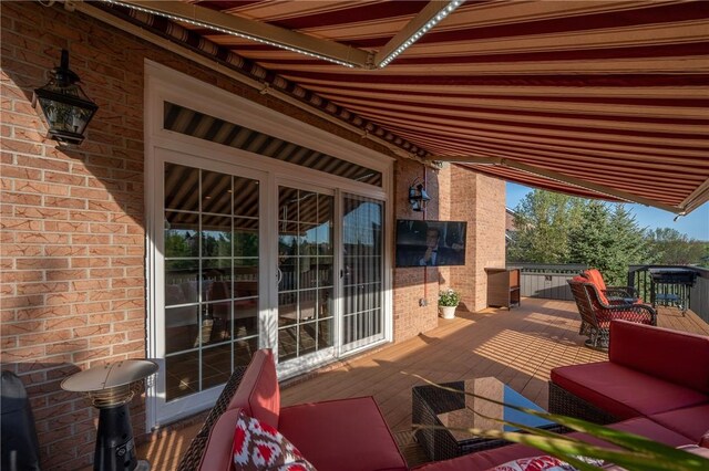 view of patio / terrace featuring a wooden deck and an outdoor hangout area
