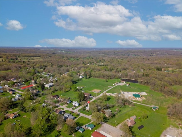 drone / aerial view featuring a forest view