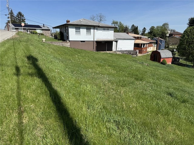 412 Helen Ave, Monessen, PA 15062 - view of yard featuring an outdoor structure and a storage unit