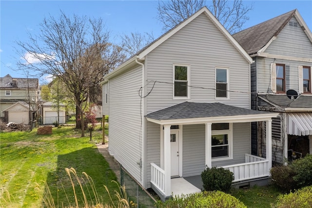 544 4th Ave, New Kensington, PA 15068 - exterior space with a lawn, roof with shingles, and covered porch