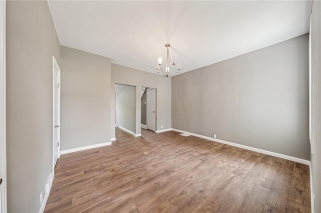 544 4th Ave, New Kensington, PA 15068 - interior space with baseboards, wood finished floors, and a chandelier
