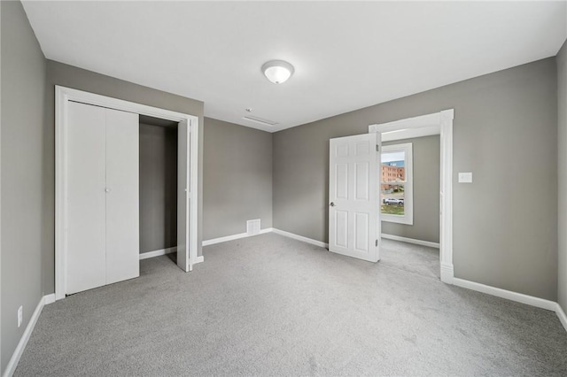 544 4th Ave, New Kensington, PA 15068 - unfurnished bedroom featuring baseboards, carpet flooring, and a closet