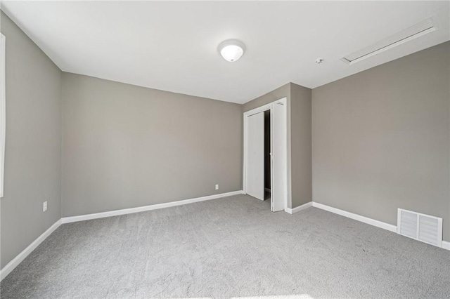 544 4th Ave, New Kensington, PA 15068 - unfurnished bedroom with carpet floors, baseboards, visible vents, and a closet