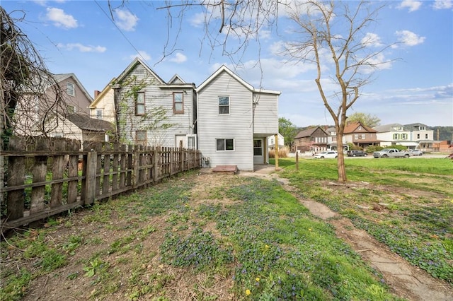 544 4th Ave, New Kensington, PA 15068 - back of property with a yard, fence, and a residential view