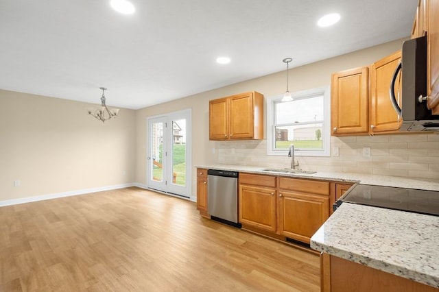 1809 Coursin St, Mckeesport, PA 15132 - kitchen with a sink, tasteful backsplash, light wood-style floors, and dishwasher