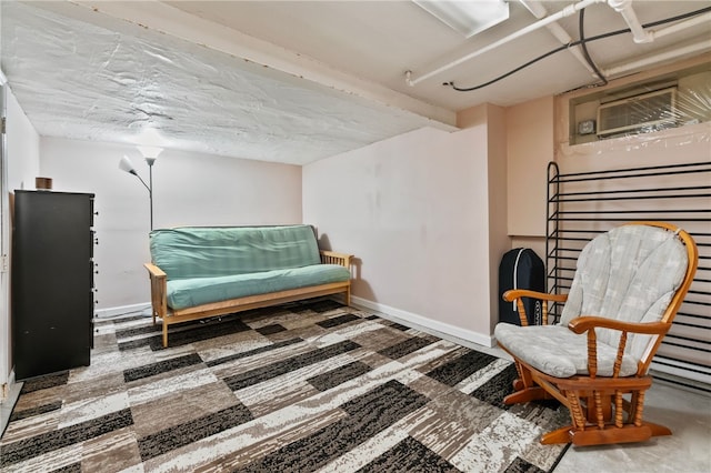 living area featuring baseboards