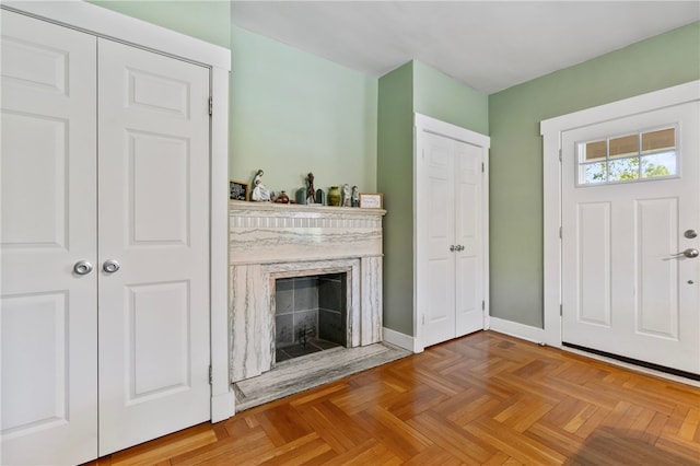 entryway with a fireplace