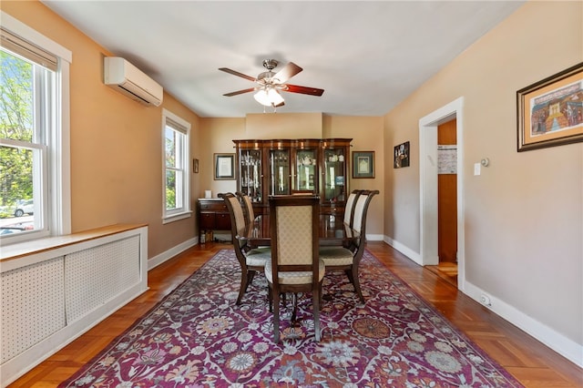 dining room featuring baseboards, an AC wall unit, ceiling fan, and radiator heating unit