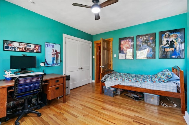 bedroom featuring a closet, a ceiling fan, and wood finished floors