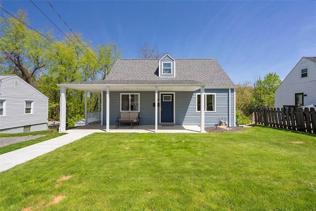 607 Hickory Dr, Hopewell Twp Bea, PA 15001 - back of house with fence, a shingled roof, and a lawn
